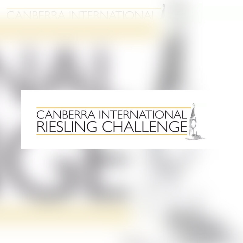 The Canberra International Riesling Challenge logo: the event name in black beneath gold rules, beside a sketch of a bottle pouring into a glass.